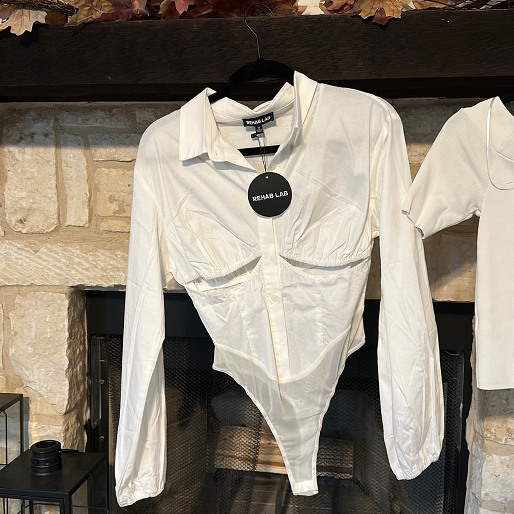 White long sleeve body suit with cut outs in the front size Medium